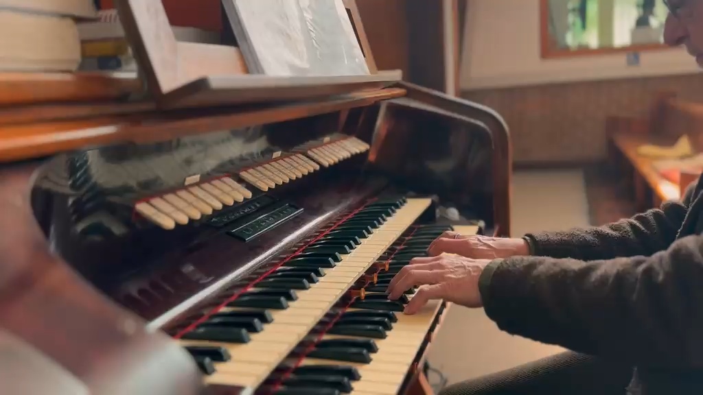 Philip's hands playing the organ manuals